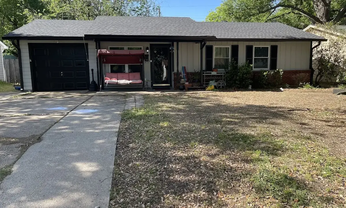 Asphalt Shingle Roof Repair crew at work on a residential roof in Wilmington